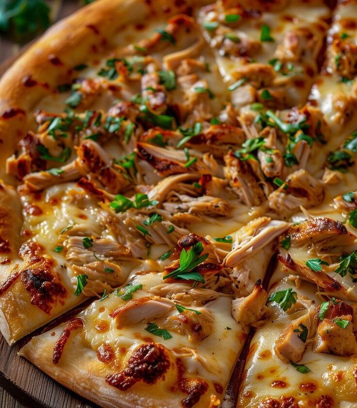 Chicken Pizza with Lots of Cheese and Fresh Herbs